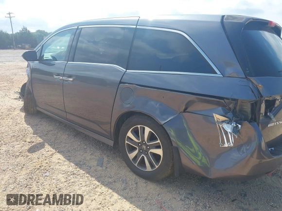 2015 Honda Odyssey Touring Elite with VIN 5FNRL5H95FB127156, listed as a IAAI auction lot 42618059 with 160,074 mi miles and . Bid and sale history available at DreamBid. Image 3.