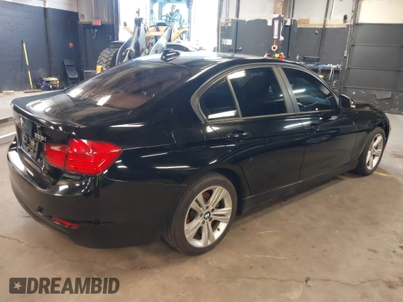 2014 BMW 3 Series 328i xDrive with VIN WBA3B3G50ENR83599, listed as a IAAI auction lot 42106340 with 195,309 mi miles. Bid and sale history available at carsss.com. Image 4.