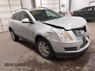 2013 Cadillac SRX z VIN 3GYFNAE34DS608231, wystawiony jako IAAI lot #41114879 z przebiegiem 104 784 mil mil oraz . Historia ofert i sprzedaży dostępna na DreamBid. Obrazek 1.