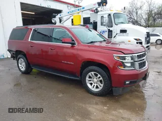 2020 Chevrolet Suburban LT with VIN 1GNSKHKC9LR233603, listed as a IAAI auction lot 41311582 with 104,754 mi miles. Bid and sale history available at carsss.com. Image 1.