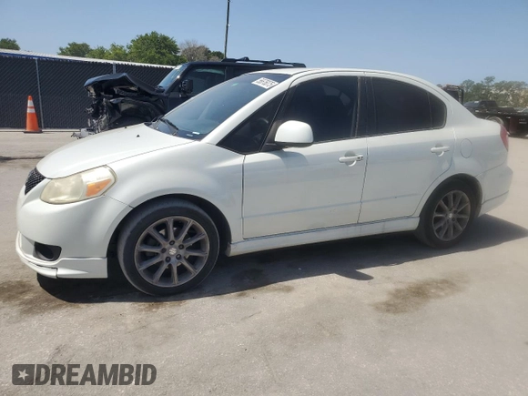 2009 Suzuki SX4 z VIN JS2YC416396200021, wystawiony jako Copart lot #56676075 z przebiegiem 150 981 mil mil oraz Szkoda całkowita • Salvage title. Historia ofert i sprzedaży dostępna na DreamBid. Obrazek 1.