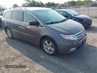 2012 Honda Odyssey Touring с VIN 5FNRL5H92CB059118, выставлен на аукционе IAAI как лот 42415626 с пробегом 171 513 миль миль и . История ставок и продаж доступна на DreamBid. Изображение 1.