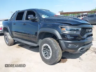 2021 Ram 1500 TRX with VIN 1C6SRFU98MN902423, listed as a IAAI auction lot 42253634 with 26,024 mi miles and . Bid and sale history available at DreamBid. Image 1.