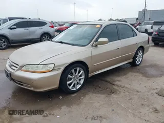 2001 Honda Accord EX z VIN 1HGCG165X1A077702, wystawiony jako IAAI lot #41770556 z przebiegiem 149 516 mil mil oraz . Historia ofert i sprzedaży dostępna na DreamBid. Obrazek 2.