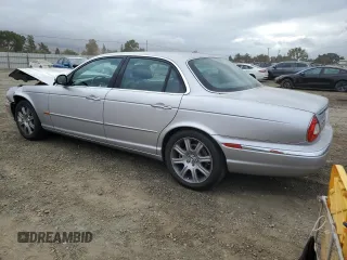 2004 Jaguar XJ with VIN SAJEA74C34SG09548, listed as a Copart auction lot 71754774 with 142,804 mi miles and Salvage Title. Bid and sale history available at DreamBid. Image 2.