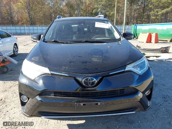 2018 Toyota RAV4 XLE with VIN 2T3RFREV9JW793956, listed as a IAAI auction lot 41012152 with 77,033 mi miles. Bid and sale history available at carsss.com. Image 13.
