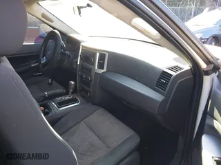 2009 Jeep Grand Cherokee Laredo with VIN 1J8GS48K29C518895, listed as a IAAI auction lot 41161045 with 153,499 mi miles. Bid and sale history available at carsss.com. Image 5.