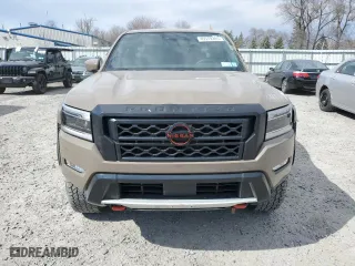 2022 Nissan Frontier PRO-4X with VIN 1N6ED1EK0NN671881, listed as a Copart auction lot 49579385 with 22,061 mi miles and Salvage Title. Bid and sale history available at carsss.com. Image 5.