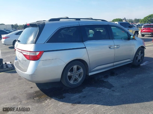 2012 Honda Odyssey Touring with VIN 5FNRL5H90CB066469, listed as a IAAI auction lot 41463009 with NaN miles. Bid and sale history available at carsss.com. Image 4.