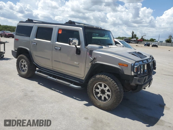 2003 Hummer H2 z VIN 5GRGN23U33H142552, wystawiony jako Copart lot #61152055 z przebiegiem Nie podano mil oraz Czysty tytuł • Clean title. Historia ofert i sprzedaży dostępna na DreamBid. Obrazek 4.
