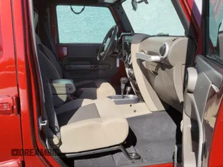 2010 Jeep Wrangler Unlimited Sahara with VIN 1J4BA5H10AL117474, listed as a IAAI auction lot 41969202 with 131,256 mi miles. Bid and sale history available at carsss.com. Image 5.