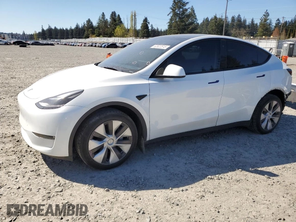 2023 Tesla Model Y Long Range z VIN 7SAYGDEE7PF788932, wystawiony jako Copart lot #52822515 z przebiegiem 33 007 mil mil oraz Szkoda całkowita • Salvage title. Historia ofert i sprzedaży dostępna na DreamBid. Obrazek 1.