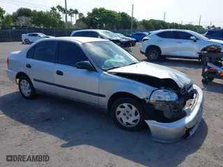 1997 Honda Civic LX with VIN 2HGEJ6671VH547275, listed as a IAAI auction lot 41640244 with 202,852 mi miles. Bid and sale history available at carsss.com. Image 1.