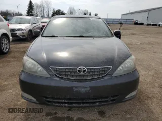 2004 Toyota Camry LE with VIN JTDBE32K940288536, listed as a Copart auction lot 54106555 with 246,661 mi miles and Clean Title. Bid and sale history available at DreamBid. Image 5.