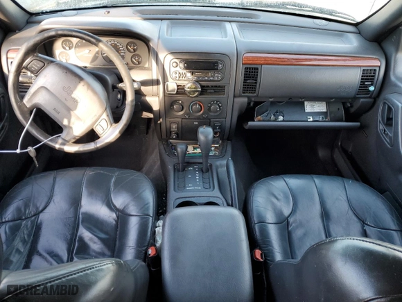 1999 Jeep Grand Cherokee Laredo with VIN 1J4GW58N1XC737706, listed as a Copart auction lot 83107914 with 0 mi miles and Salvage Title. Bid and sale history available at carsss.com. Image 8.