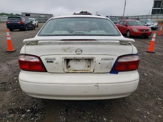 2001 Mazda 626 LX z VIN 1YVGF22C515251837, wystawiony jako Copart lot #56854605 z przebiegiem 173 148 mil mil oraz Szkody całkowita. Historia ofert i sprzedaży dostępna na DreamBid. Obrazek 6.