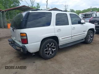 2005 GMC Yukon SLT z VIN 1GKEC13T75R114660, wystawiony jako IAAI lot #42223845 z przebiegiem 199 064 mil mil oraz . Historia ofert i sprzedaży dostępna na DreamBid. Obrazek 4.