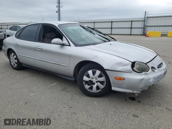 1999 Ford Taurus SE with VIN 1FAFP53U9XG290036, listed as a Copart auction lot 53505065 with 200,149 mi miles and Salvage title. Bid and sale history available at DreamBid. Image 4.