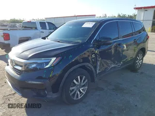 2021 Honda Pilot EX-L with VIN 5FNYF5H55MB044677, listed as a IAAI auction lot 42038704 with 38,684 mi miles and . Bid and sale history available at carsss.com. Image 18.