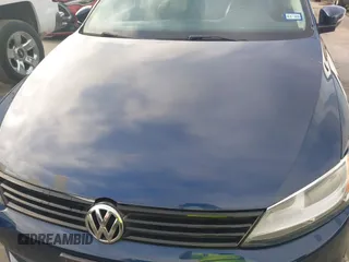 2014 Volkswagen Jetta SE z VIN 3VWD17AJ5EM369548, wystawiony jako IAAI lot #42588501 z przebiegiem 115 062 mil mil oraz . Historia ofert i sprzedaży dostępna na DreamBid. Obrazek 6.