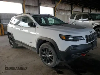 2022 Jeep Cherokee Trailhawk with VIN 1C4PJMBX6ND556259, listed as a Copart auction lot 44730605 with 55,328 mi miles and Non Repairable. Bid and sale history available at carsss.com. Image 4.