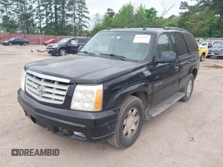 2005 Cadillac Escalade z VIN 1GYEC63TX5R203156, wystawiony jako IAAI lot #41937137 z przebiegiem 239 919 mil mil oraz . Historia ofert i sprzedaży dostępna na DreamBid. Obrazek 2.