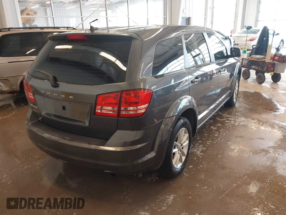 2014 Dodge Journey American Value Pkg with VIN 3C4PDCAB1ET153064, listed as a IAAI auction lot 41254848 with 179,905 mi miles. Bid and sale history available at carsss.com. Image 4.