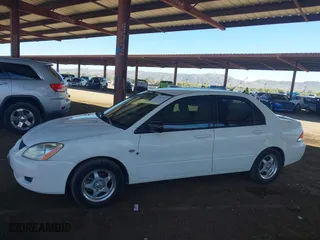 2004 Mitsubishi Lancer ES with VIN JA3AJ26E14U065498, listed as a IAAI auction lot 41887945 with 142,632 mi miles. Bid and sale history available at carsss.com. Image 14.