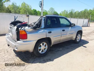 2004 GMC Envoy SLE with VIN 1GKDS13S242420100, listed as a IAAI auction lot 41963800 with 341,395 mi miles and . Bid and sale history available at DreamBid. Image 4.