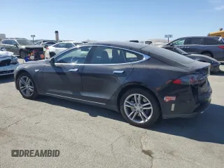 2016 Tesla Model S 90D with VIN 5YJSA1E2XGF129106, listed as a Copart auction lot 59162185 with 136,004 mi miles and Salvage title. Bid and sale history available at DreamBid. Image 2.