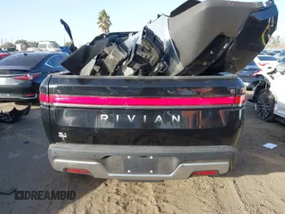 2023 Rivian R1T Adventure with VIN 7FCTGAAAXPN022097, listed as a IAAI auction lot 41235625 with 11,210 mi miles. Bid and sale history available at carsss.com. Image 17.