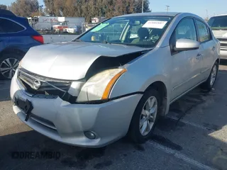 2011 Nissan Sentra SR with VIN 3N1AB6AP4BL658832, listed as a IAAI auction lot 41802807 with 136,924 mi miles and . Bid and sale history available at DreamBid. Image 2.