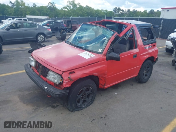 1995 Chevrolet Tracker z VIN 2CNBJ1869S6902771, wystawiony jako IAAI lot #41997456 z przebiegiem 171 629 mil mil oraz . Historia ofert i sprzedaży dostępna na DreamBid. Obrazek 2.