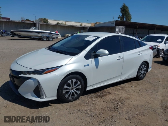 2021 Toyota Prius LE with VIN JTDKAMFP2M3184900, listed as a IAAI auction lot 42014569 with 81,563 mi miles and . Bid and sale history available at DreamBid. Image 2.