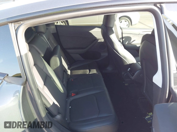 2023 Tesla Model Y Long Range with VIN 7SAYGDEE0PF928836, listed as a IAAI auction lot 41538742 with 9,630 mi miles and . Bid and sale history available at DreamBid. Image 8.