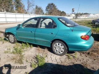 2000 Hyundai Elantra GLS z VIN KMHJF35FXYU998689, wystawiony jako Copart lot #76181814 z przebiegiem 154 743 mil mil oraz Szkoda całkowita • Salvage title. Historia ofert i sprzedaży dostępna na DreamBid. Obrazek 2.