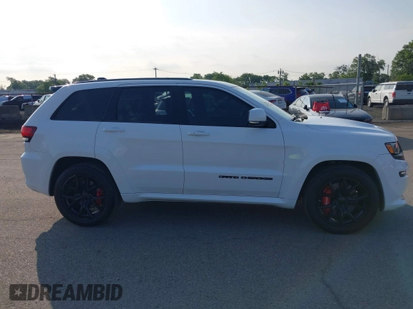 2016 Jeep Grand Cherokee SRT with VIN 1C4RJFDJ3GC503878, listed as a IAAI auction lot 42830257 with 82,661 mi miles and . Bid and sale history available at DreamBid. Image 13.