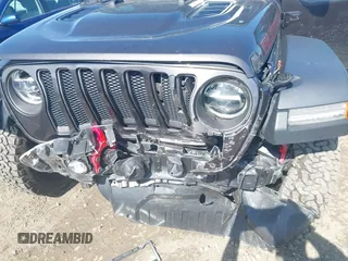 2021 Jeep Wrangler Unlimited Rubicon with VIN 1C4HJXFN5MW509483, listed as a IAAI auction lot 42245703 with 59,461 mi miles and . Bid and sale history available at DreamBid. Image 6.