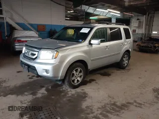 2009 Honda Pilot Touring with VIN 5FNYF48929B010331, listed as a IAAI auction lot 41965094 with 142,490 mi miles and . Bid and sale history available at carsss.com. Image 2.