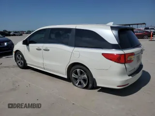 2019 Honda Odyssey Touring with VIN 5FNRL6H86KB089055, listed as a Copart auction lot 56980975 with 154,842 mi miles and Salvage title. Bid and sale history available at DreamBid. Image 2.