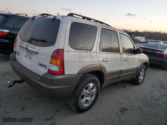 2003 Mazda Tribute LX with VIN 4F2YZ94133KM20084, listed as a Copart auction lot 82598104 with 216,848 mi miles and Salvage Title. Bid and sale history available at carsss.com. Image 3.