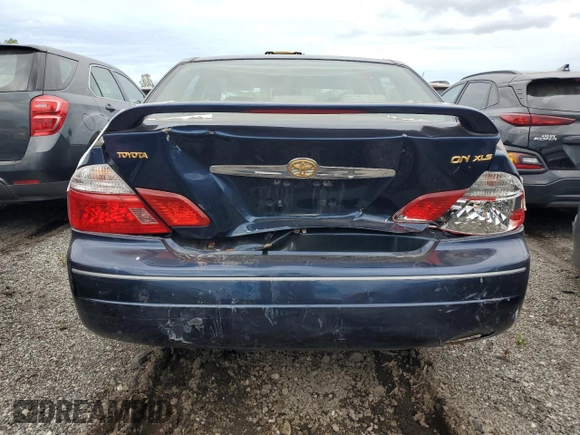 2004 Toyota Avalon XL z VIN 4T1BF28B84U342024, wystawiony jako Copart lot #56174985 z przebiegiem 166 173 mil mil oraz Szkoda całkowita • Salvage title. Historia ofert i sprzedaży dostępna na DreamBid. Obrazek 6.