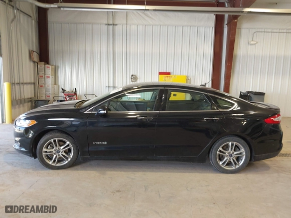 2016 Ford Fusion Titanium Hybrid with VIN 3FA6P0RU7GR127307, listed as a IAAI auction lot 41944427 with 128,076 mi miles. Bid and sale history available at carsss.com. Image 15.