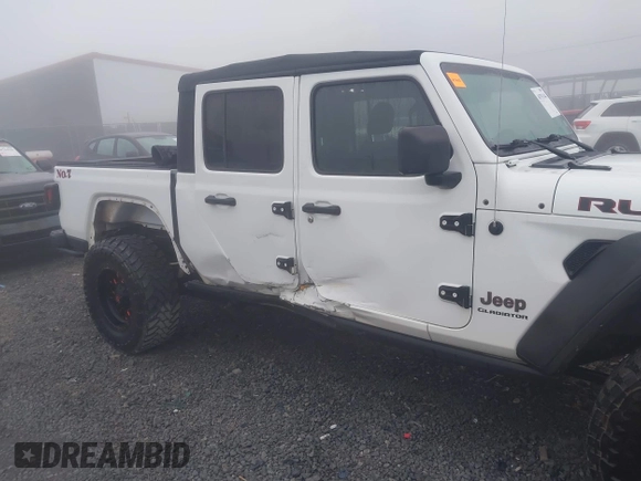 2022 Jeep Gladiator Rubicon z VIN 1C6JJTBG3NL111054, wystawiony jako IAAI lot #40793144 z przebiegiem 40 115 mil mil oraz . Historia ofert i sprzedaży dostępna na DreamBid. Obrazek 6.