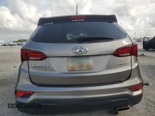 2018 Hyundai Santa Fe 2.4L z VIN 5NMZT3LB7JH080380, wystawiony jako Copart lot #54016805 z przebiegiem 138 494 mil mil oraz Nie do naprawy • Non repairable. Historia ofert i sprzedaży dostępna na DreamBid. Obrazek 6.