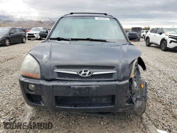 2009 Hyundai Tucson SE with VIN KM8JN72D49U975875, listed as a Copart auction lot 76923954 with 167,155 mi miles and Salvage Title. Bid and sale history available at carsss.com. Image 5.