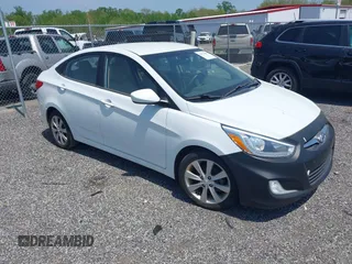 2014 Hyundai Accent GLS with VIN KMHCU4AE8EU589409, listed as a IAAI auction lot 42171087 with 209,204 mi miles. Bid and sale history available at carsss.com. Image 1.
