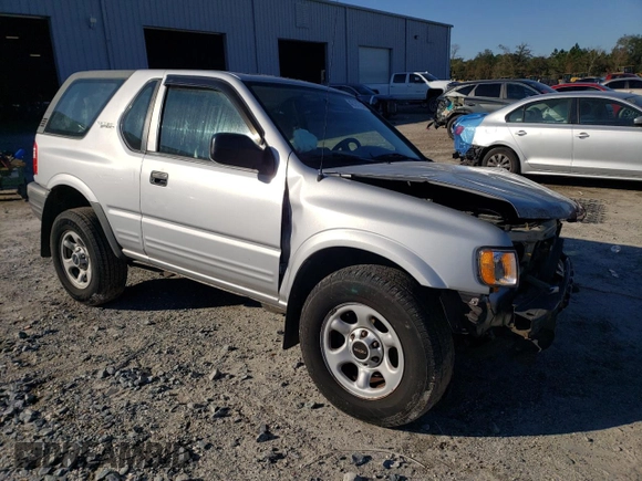 2002 Isuzu Rodeo z VIN 4S2CK57W524323426, wystawiony jako Copart lot #42191765 z przebiegiem 112 024 mil mil oraz Szkoda całkowita • Salvage title. Historia ofert i sprzedaży dostępna na DreamBid. Obrazek 4.