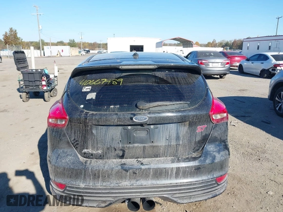 2018 Ford Focus ST with VIN 1FADP3L9XJL209180, listed as a IAAI auction lot 40667989 with 95,519 mi miles and . Bid and sale history available at DreamBid. Image 16.
