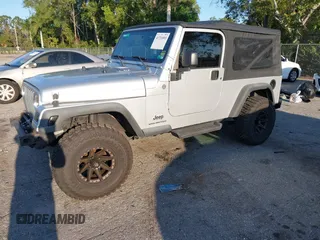 2005 Jeep Wrangler Unlimited with VIN 1J4FA44S65P335444, listed as a IAAI auction lot 41731093 with 143,918 mi miles. Bid and sale history available at carsss.com. Image 17.